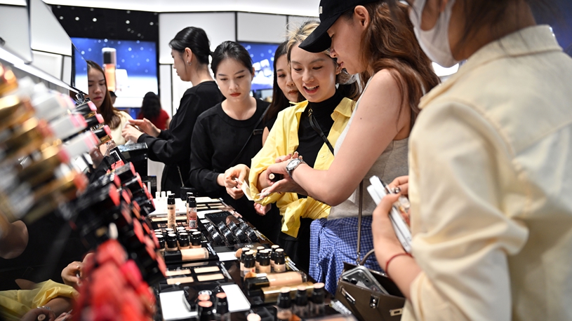Customers shop at duty-free shopping mall in Sanya, China's Hainan